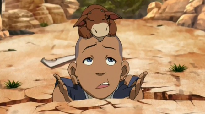 An image of Sokka from Avatar The Last Airbender stuck in a hole. 